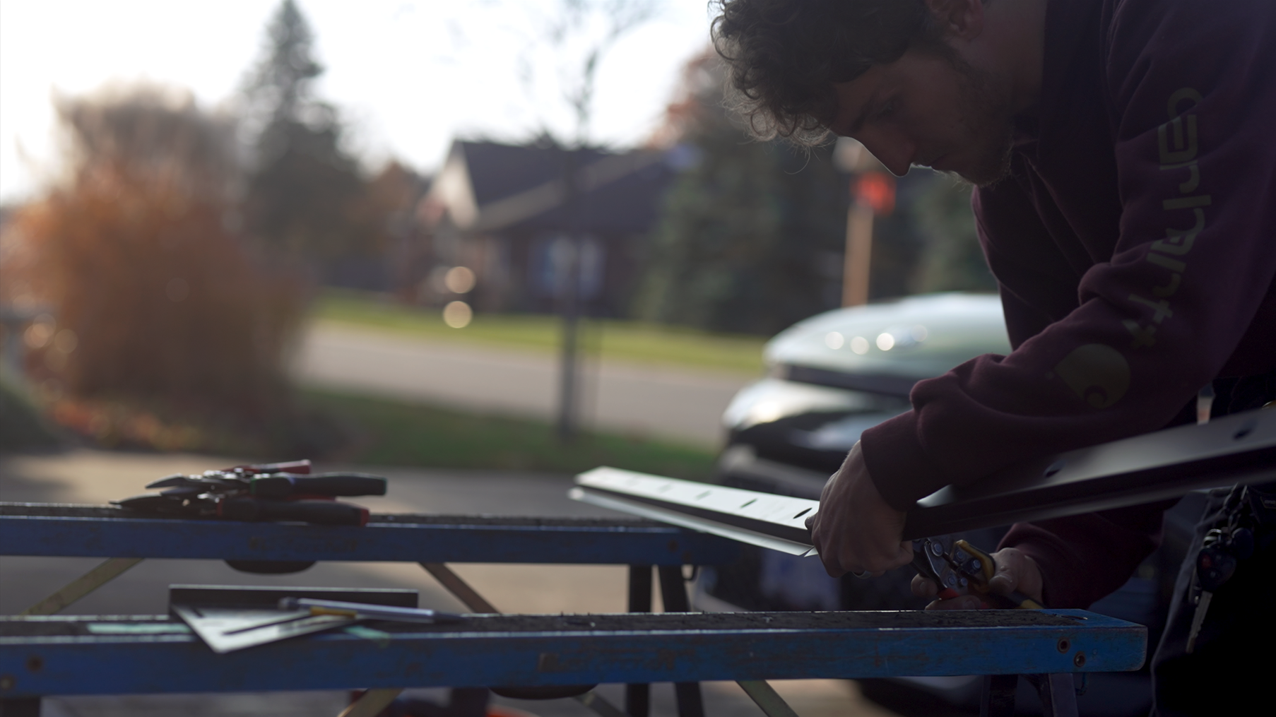 Celebright dealer preparing permanent outdoor lighting components during a residential installation