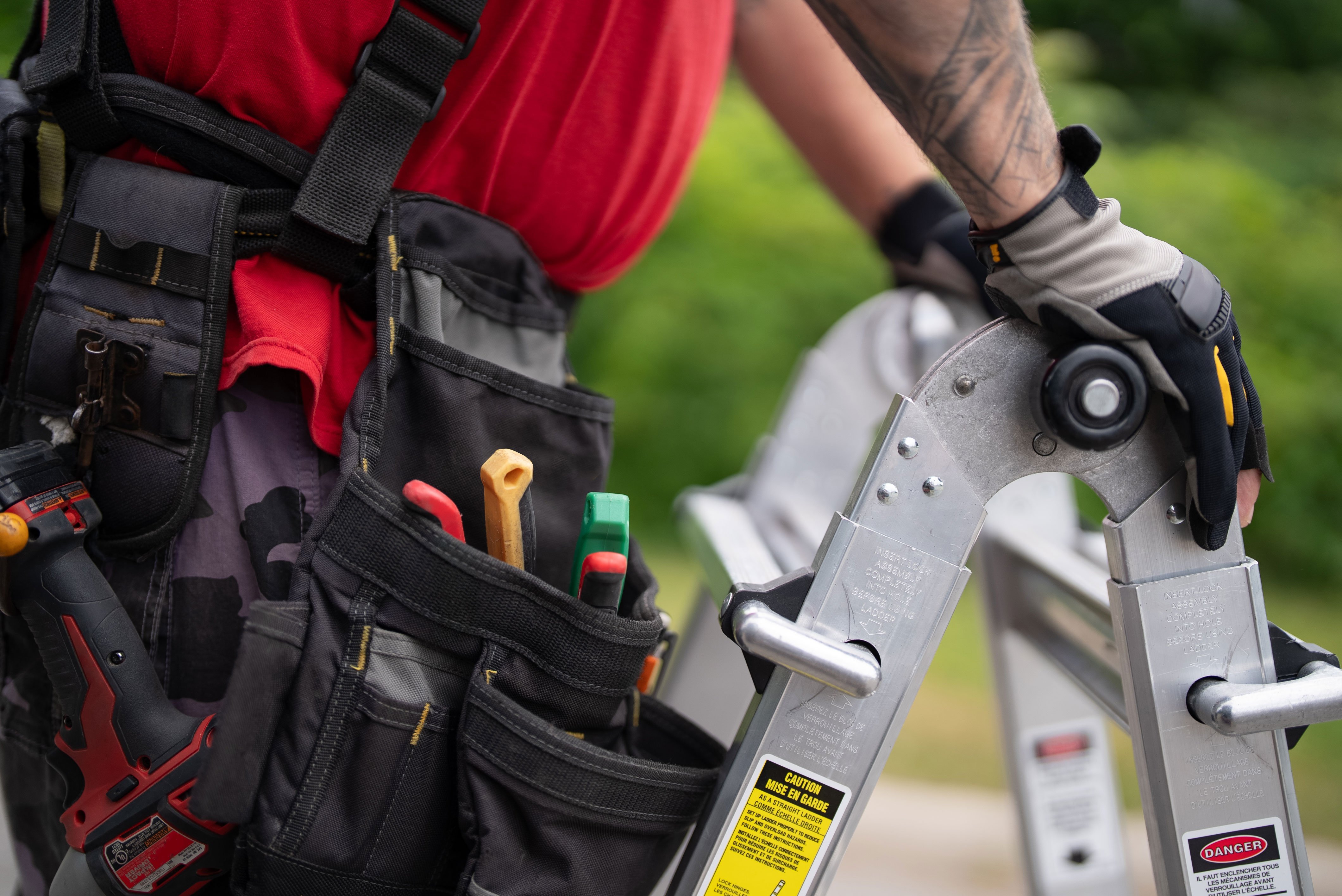 Celebright installer working on a residential permanent holiday lighting installation