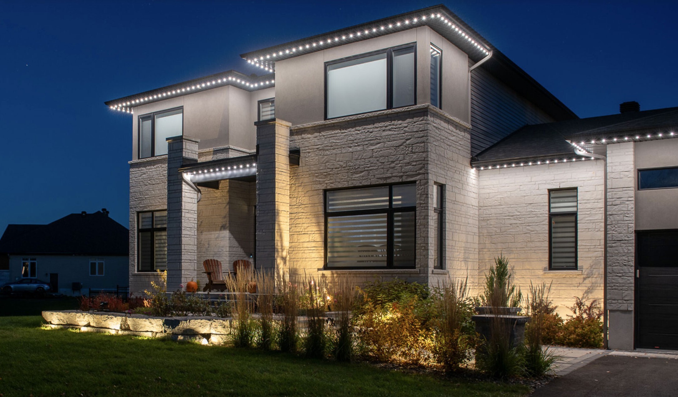 Home illuminated with warm outdoor Landscape lighting