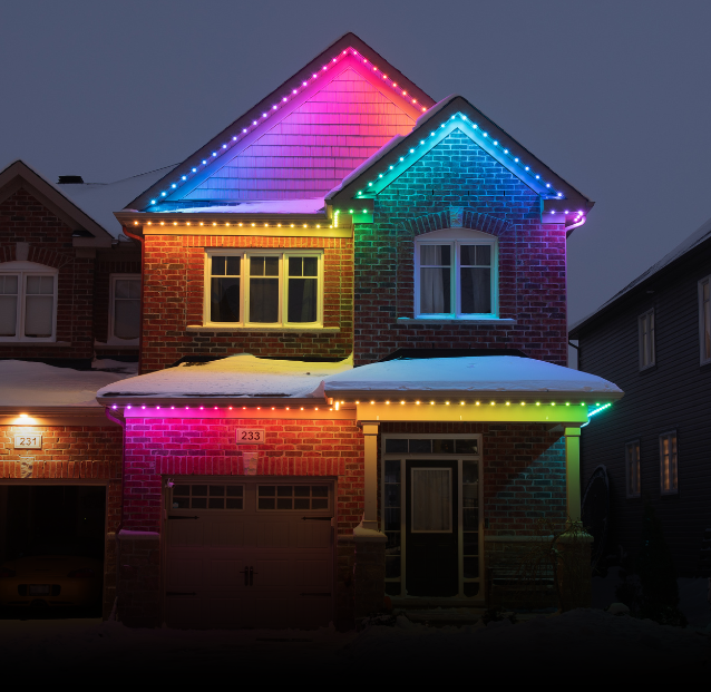 Residential home with permanent holiday lighting installed along the roofline