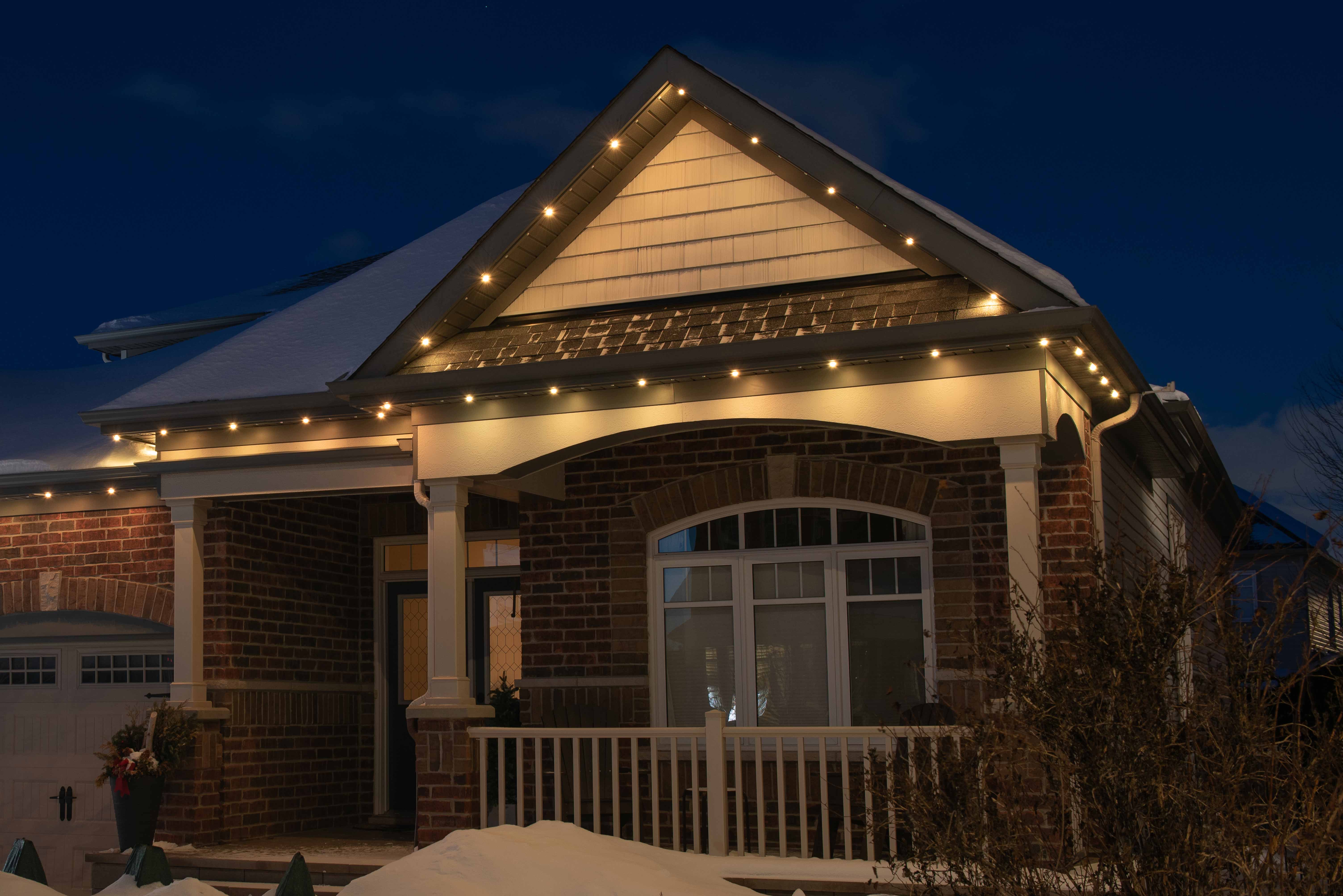House at night with Celebright permanent lights showing the 3 Spaced WW preset.