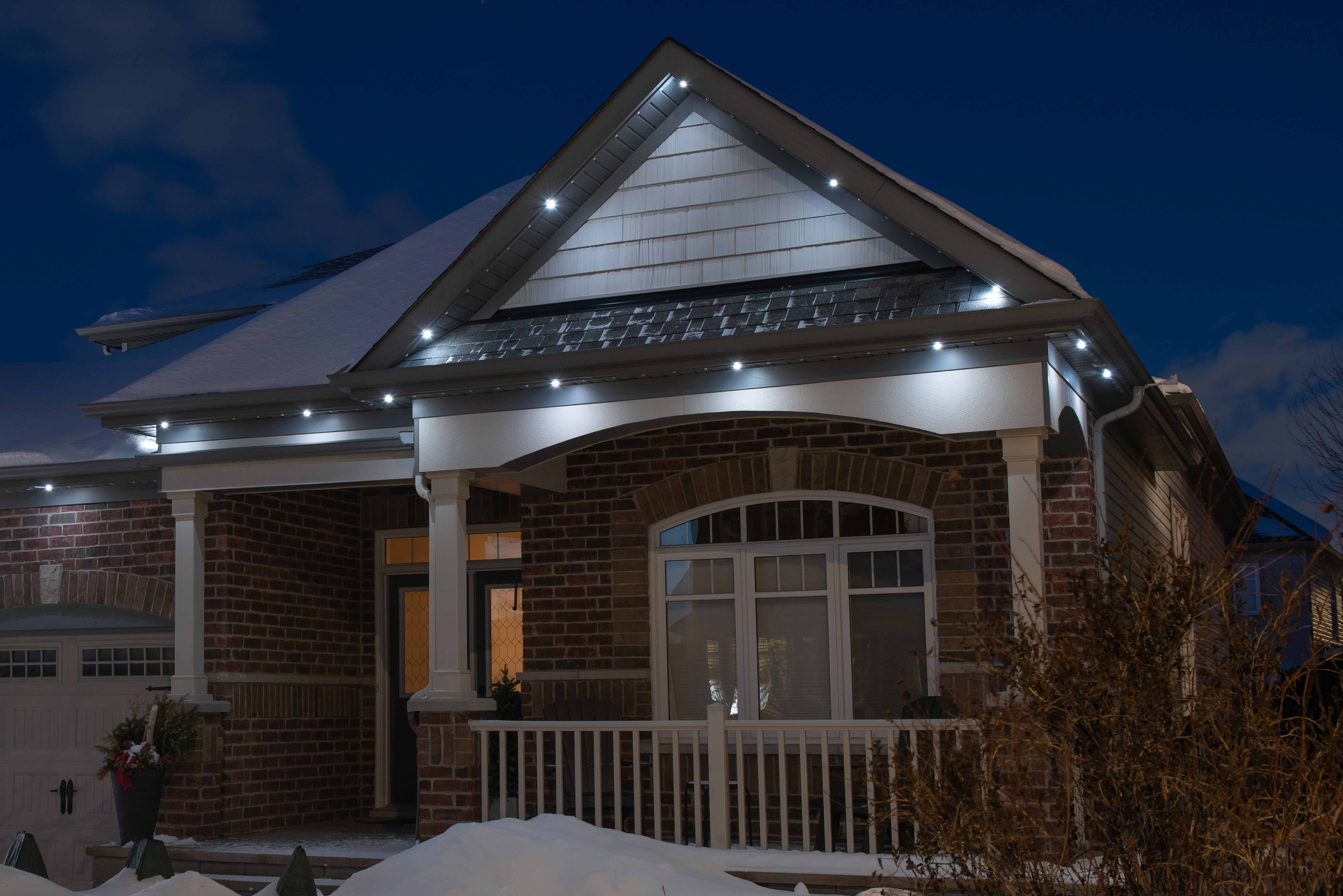 House at night with Celebright permanent lights showing the Pot-Light preset.