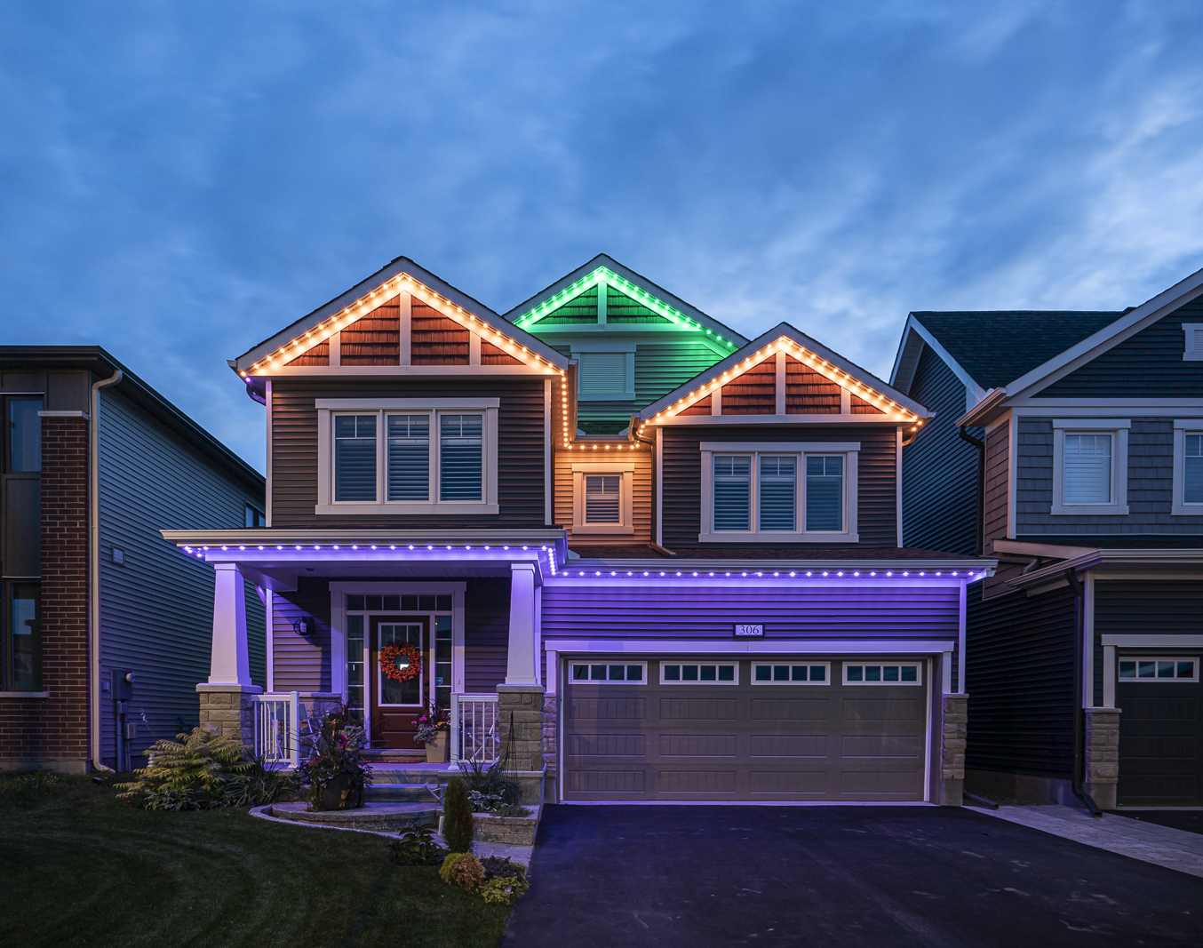Smart outdoor lighting using a Halloween preset to highlight the home’s architectural lines