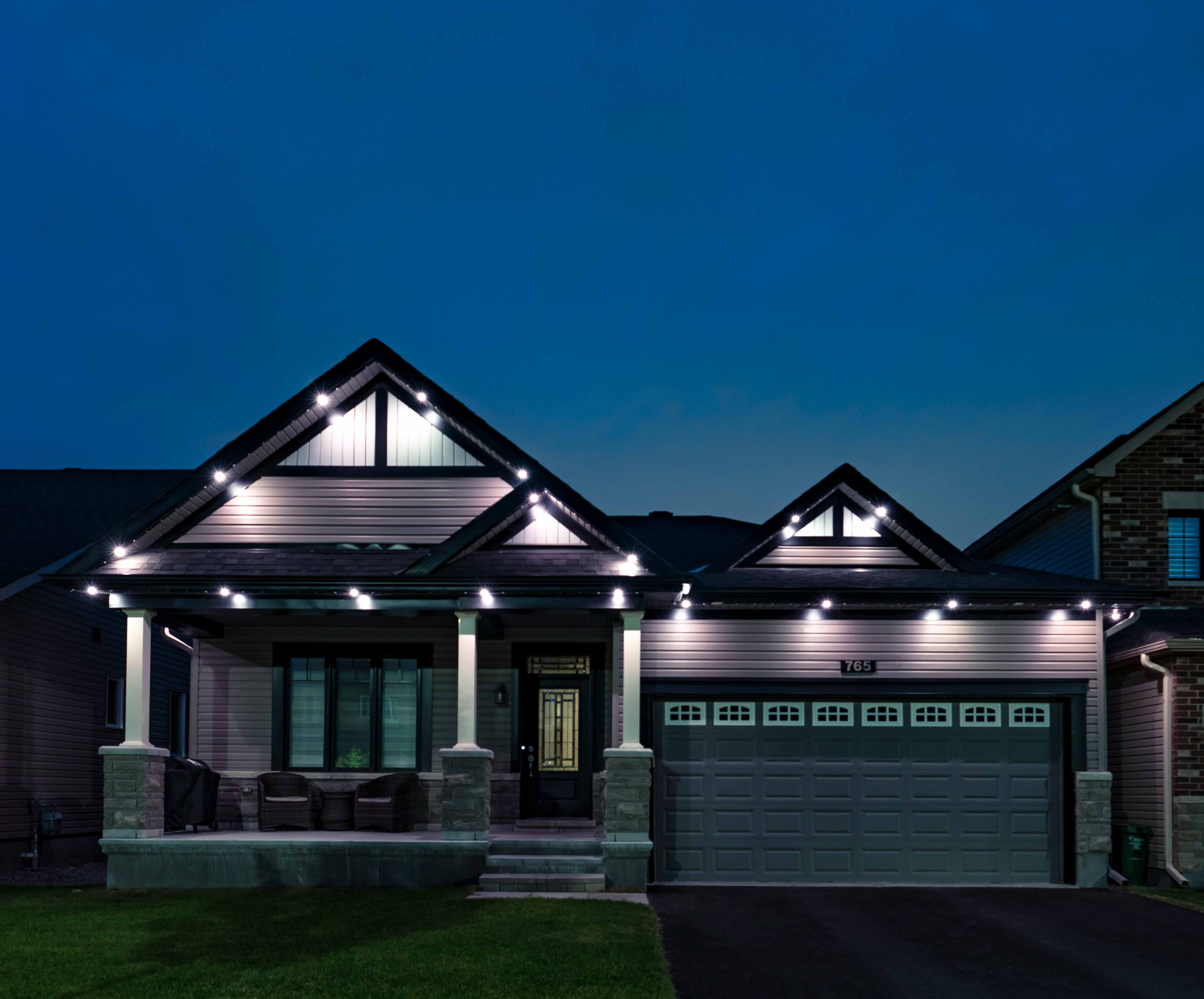 Outdoor holiday lighting installed on house